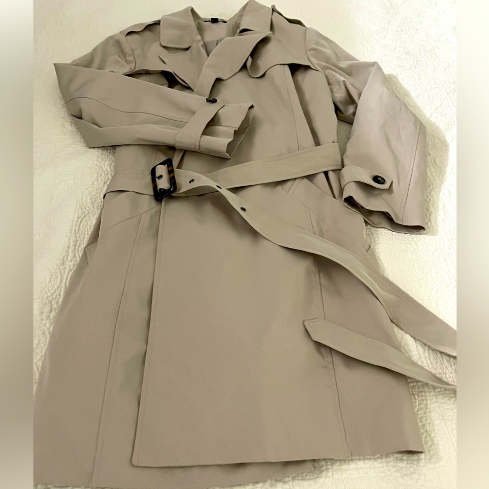 Traditional khaki raincoat. Very classy! Gently used.